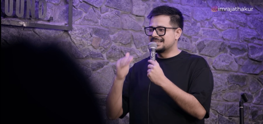 Rajat Thakur performing under stage lights
