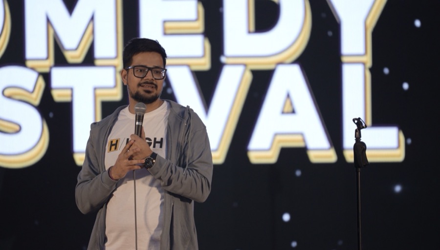 Rajat Thakur on stage at a comedy festival